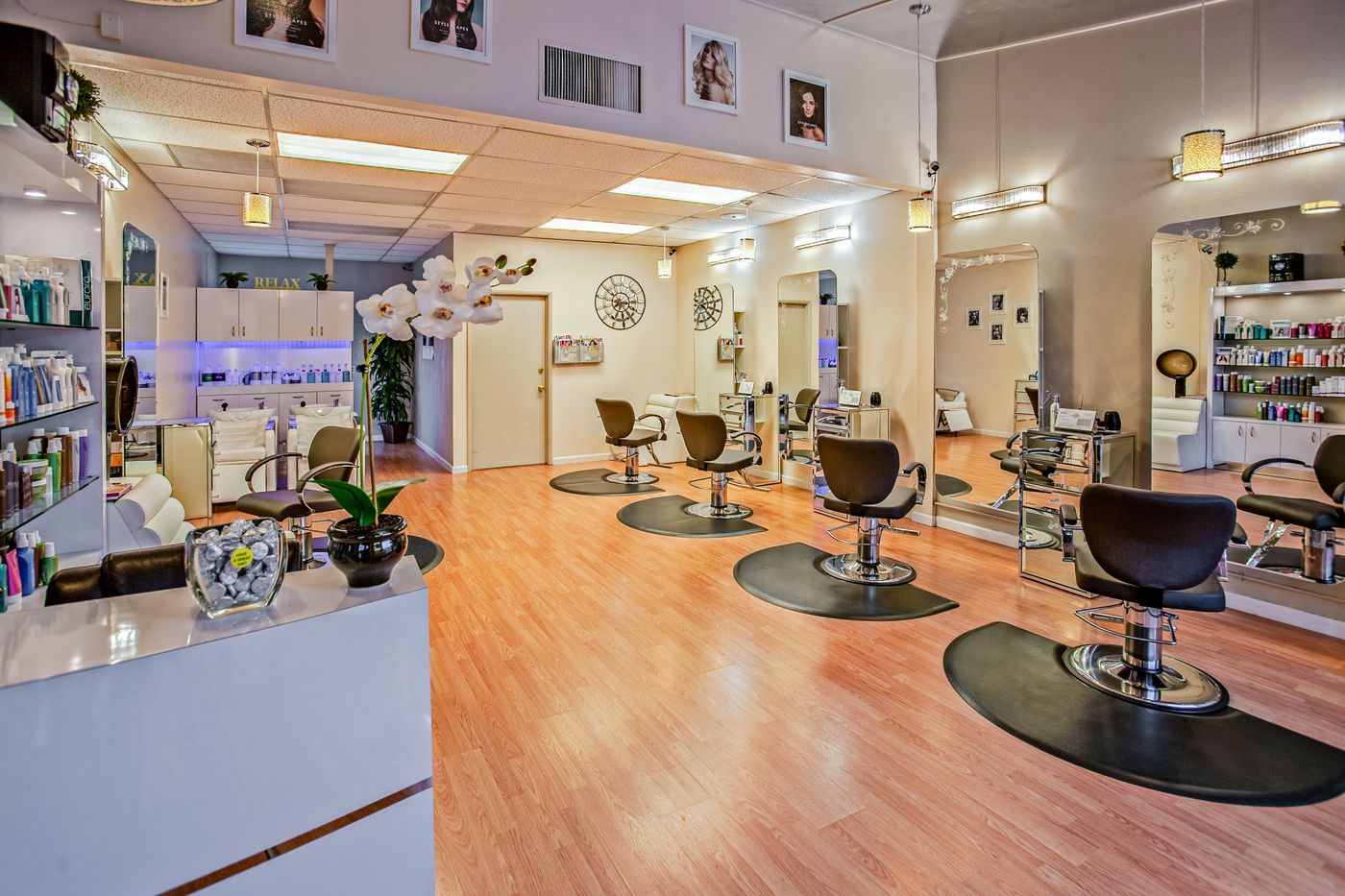 A hair salon interior with styling chairs and mirrors